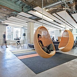 A person sitting in a hammock.