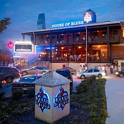 A gas station with cars parked outside.