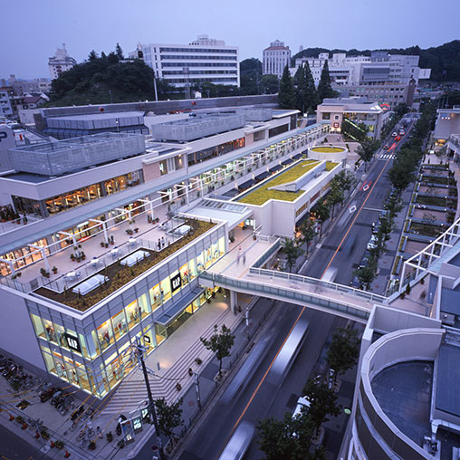 A large building with a parking lot.