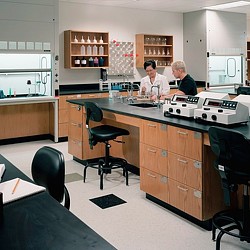 A couple of men in a kitchen.