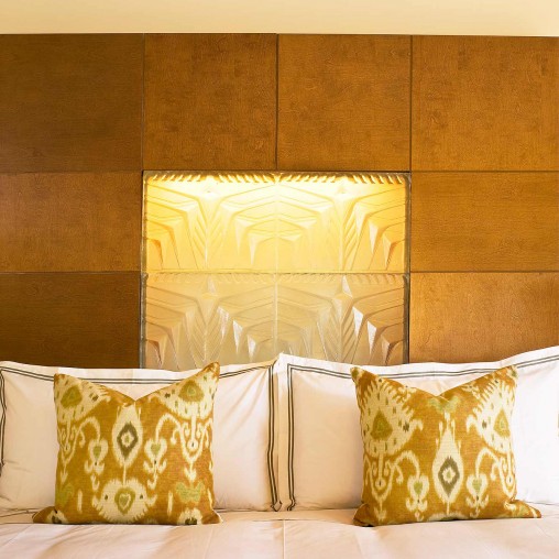 A bed with white pillows.