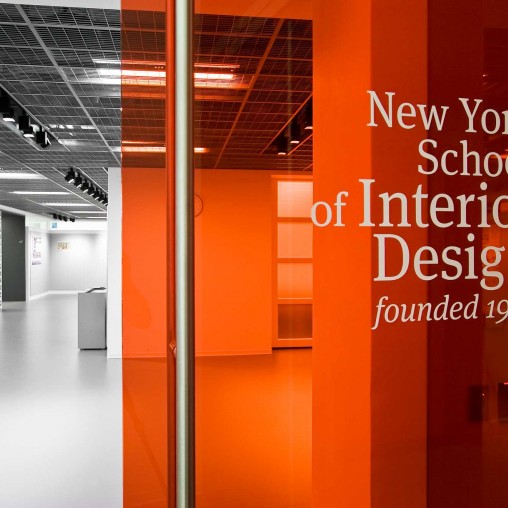 A hallway with orange walls.