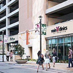 People walking on the sidewalk.