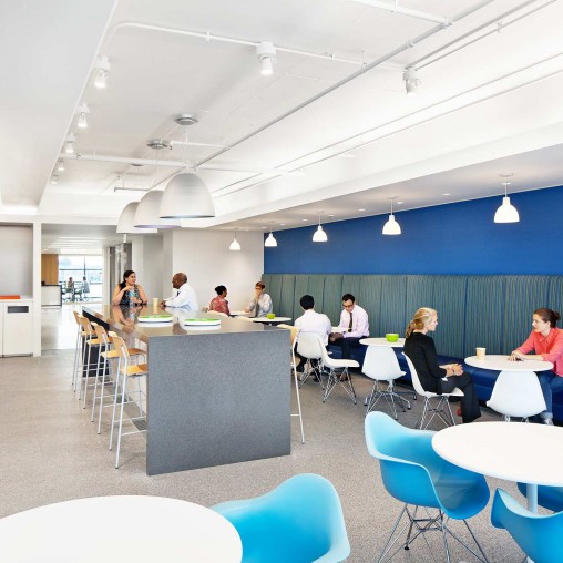 A group of people sitting at tables.