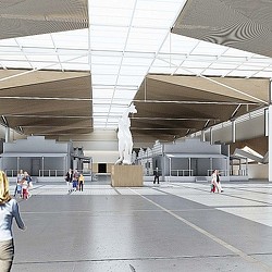 A group of people walking in a large building.