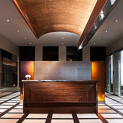 A large wooden bench in a room.