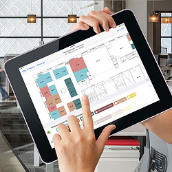 A person holding a tablet.