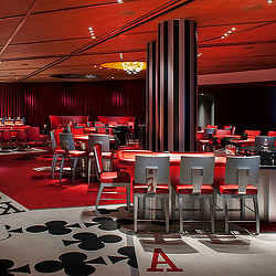 A room with tables and chairs.