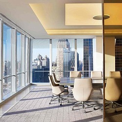 A room with a table and chairs.