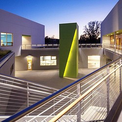 A building with a green sign.