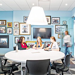 A group of women sitting at a table.