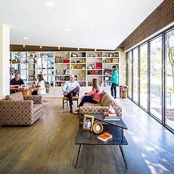 A group of people sitting in a library.