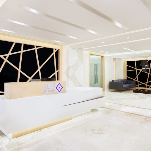 A room with a white bed and a window.