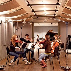 A group of people playing instruments.