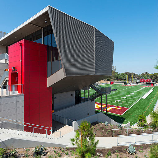 A building with a grass field.