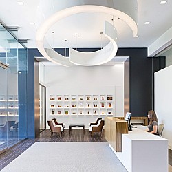A person sitting at a desk in a library.