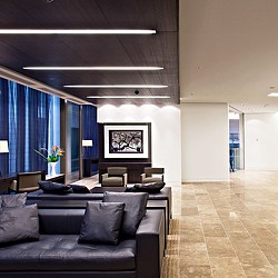 A living room with a couch and a table.