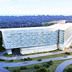 A large building with a parking lot.