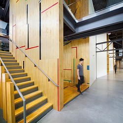 A person walking down a hall.