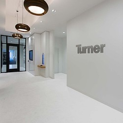 A hallway with white walls.