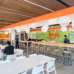 A group of people in a restaurant.