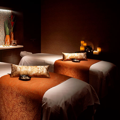 A couple of beds sit near each other.