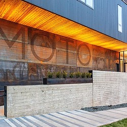 A building with a large mural on the side.