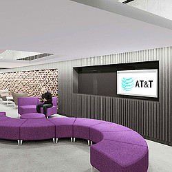 A person sitting on a purple couch.