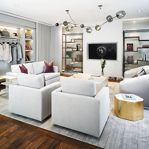 A living room with white couches.