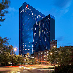 A large building with a flag on top.