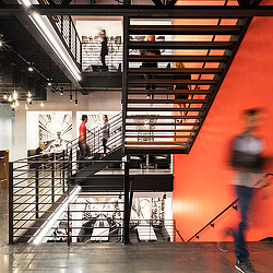 People walking up a staircase.