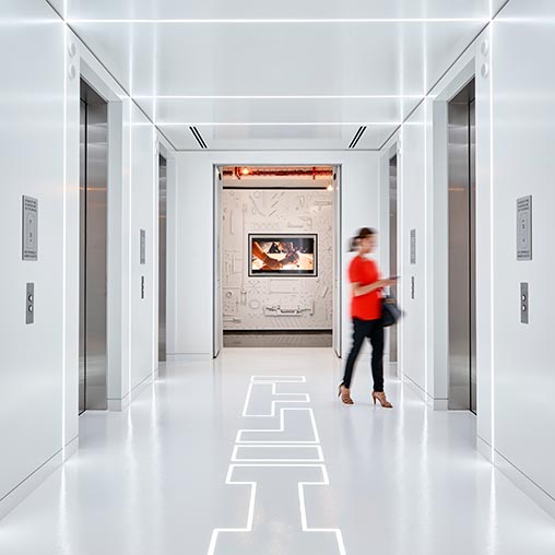 A man walking through a hallway.