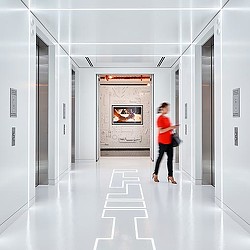 A man walking through a hallway.