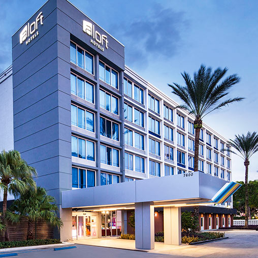 A building with palm trees.