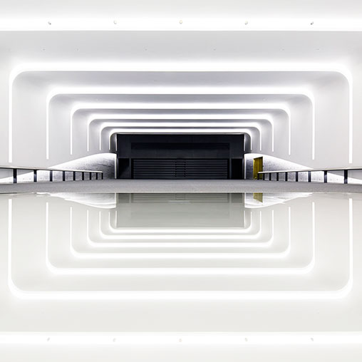 A white rectangular object with a black object on top.