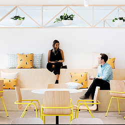 A man and a woman sitting on a couch.