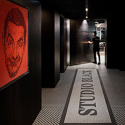 A person walking down a hallway.