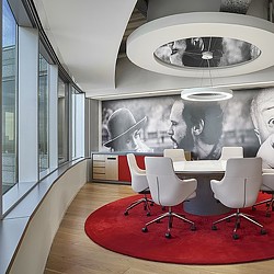 A room with a table and chairs.