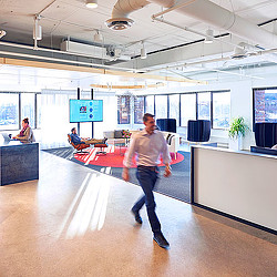 A man walking on a bowling alley.
