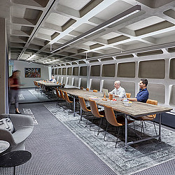 A group of people sitting at tables.