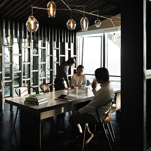 A group of people sitting at a table.