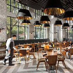 A person walking by a restaurant.