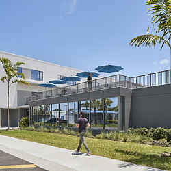 A person walking on a sidewalk.