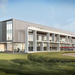 A building with a person walking in front of it.