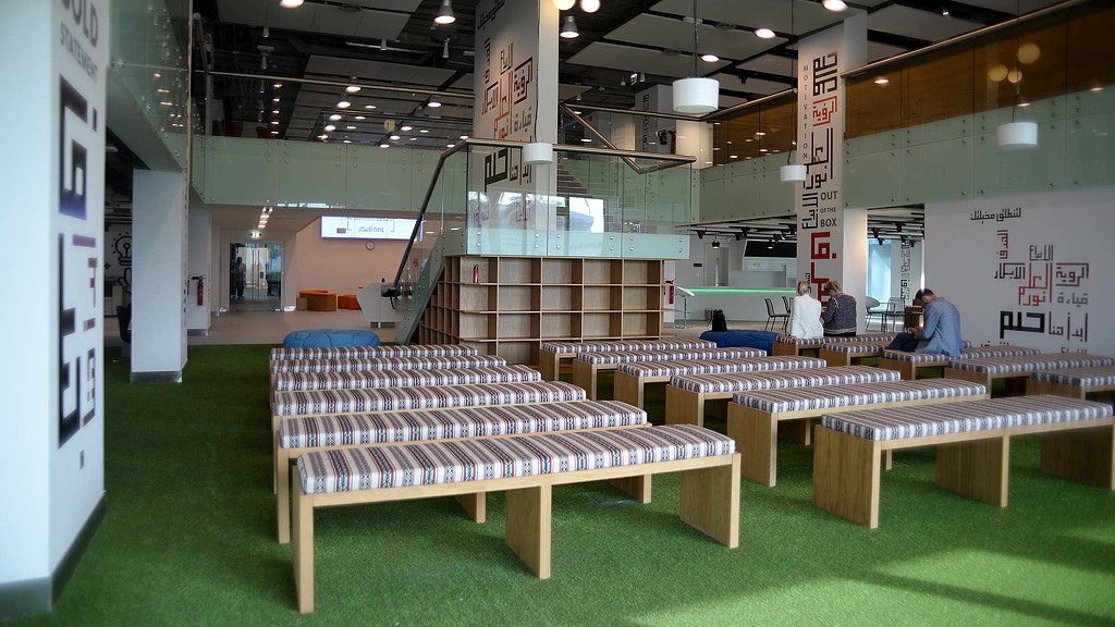 A room with tables and people.