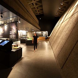 A person walking down a hall.