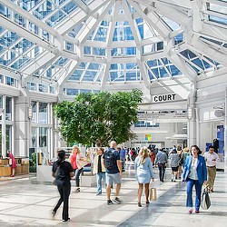A group of people walking inside a building.