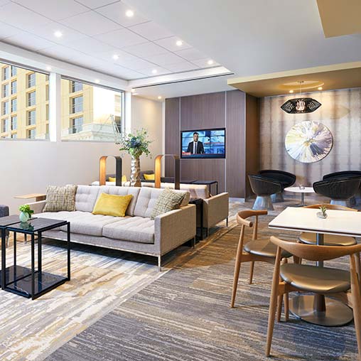 A living room with a couch and a tv.
