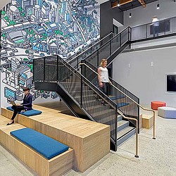 A person sitting on a bench next to a person sitting on a bench.