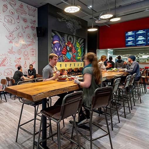 People sitting at tables in a restaurant.
